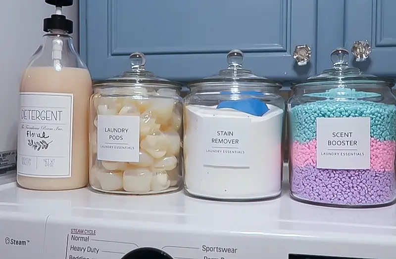 Use Clear Containers in Laundry Room Cabinet
