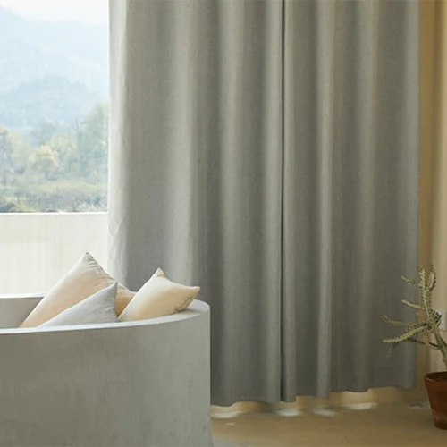 Conceal messy areas behind curtains or drapes